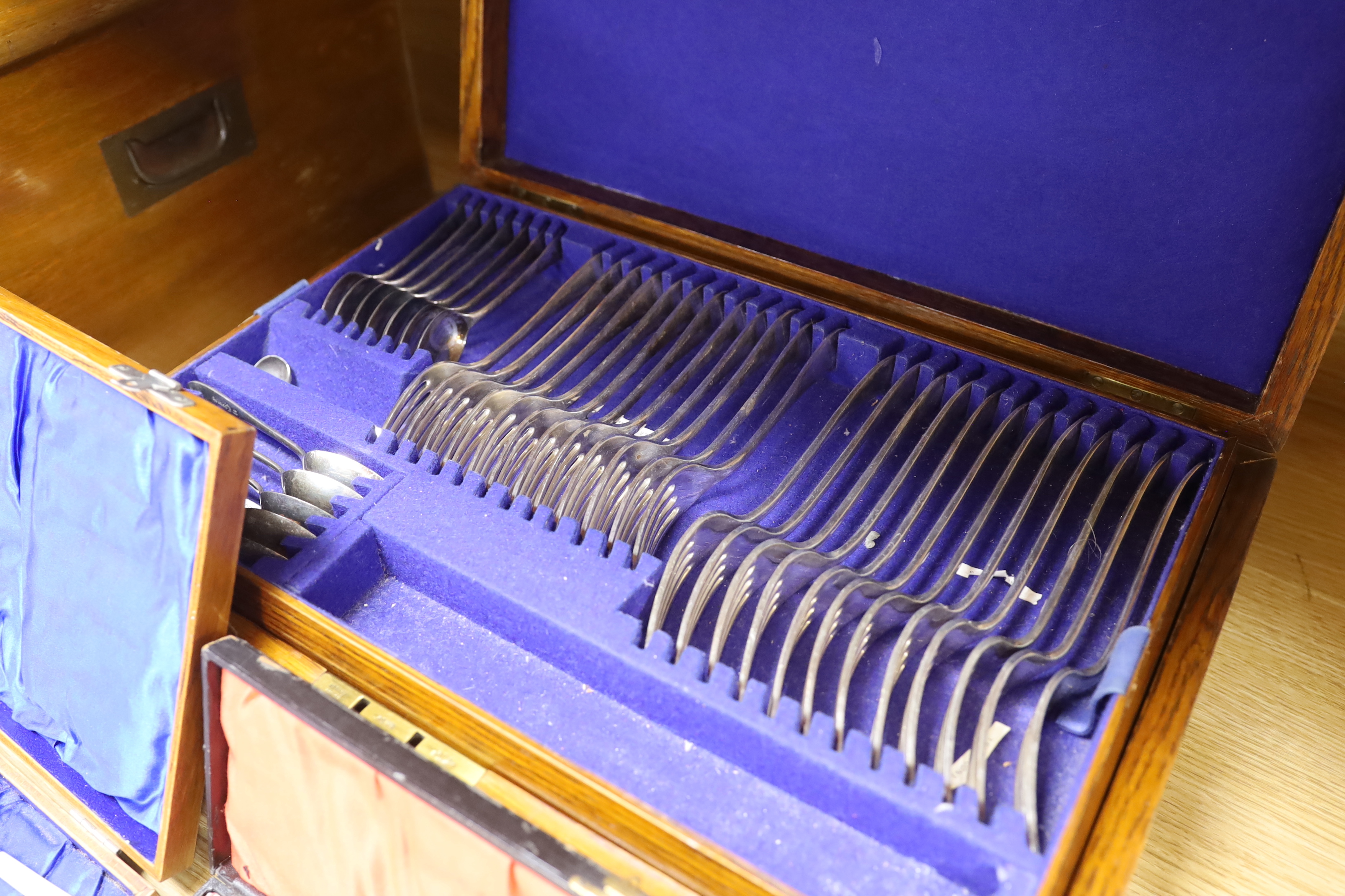 Two oak cased canteens of Old English pattern plated flatware and smaller boxes of cutlery